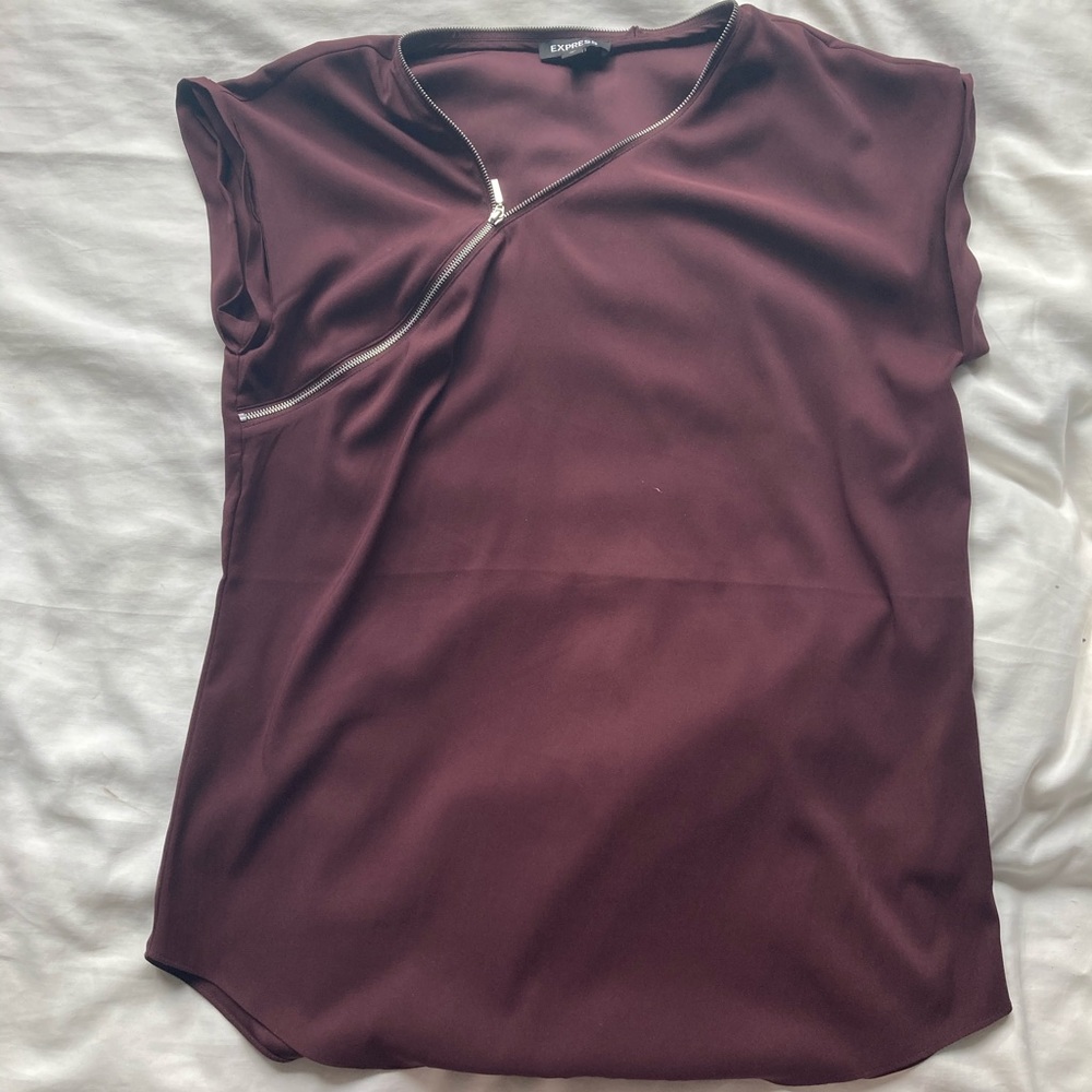 Asymmetrical zip blouse.